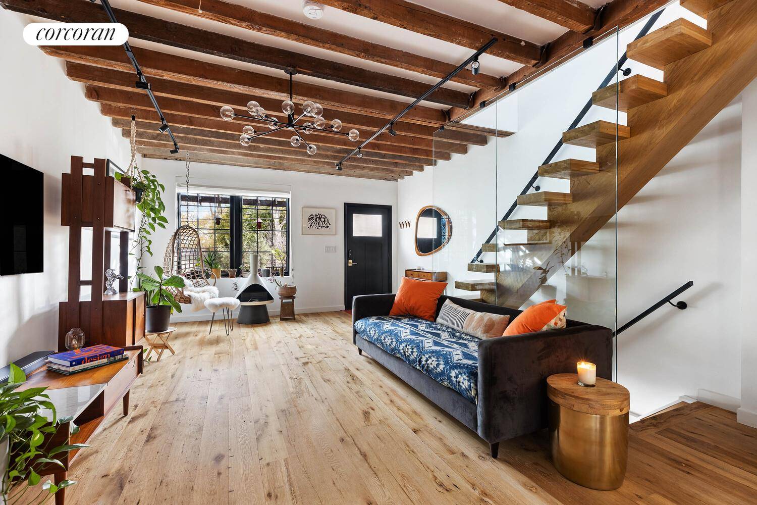 A Rare Parkside Gem with Private Parking Directly overlooking Cooper Park in Williamsburg, this beautifully reimagined single family townhouse blends modern design with a sense of warmth and comfort.
