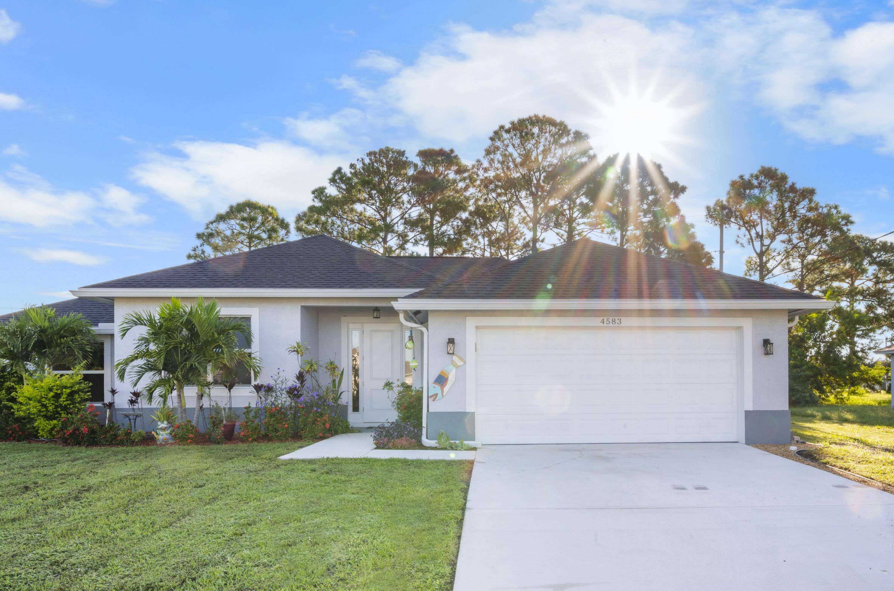 Move right into this stunning 2 year old CBS home with impact rated windows and a bright, open concept layout.