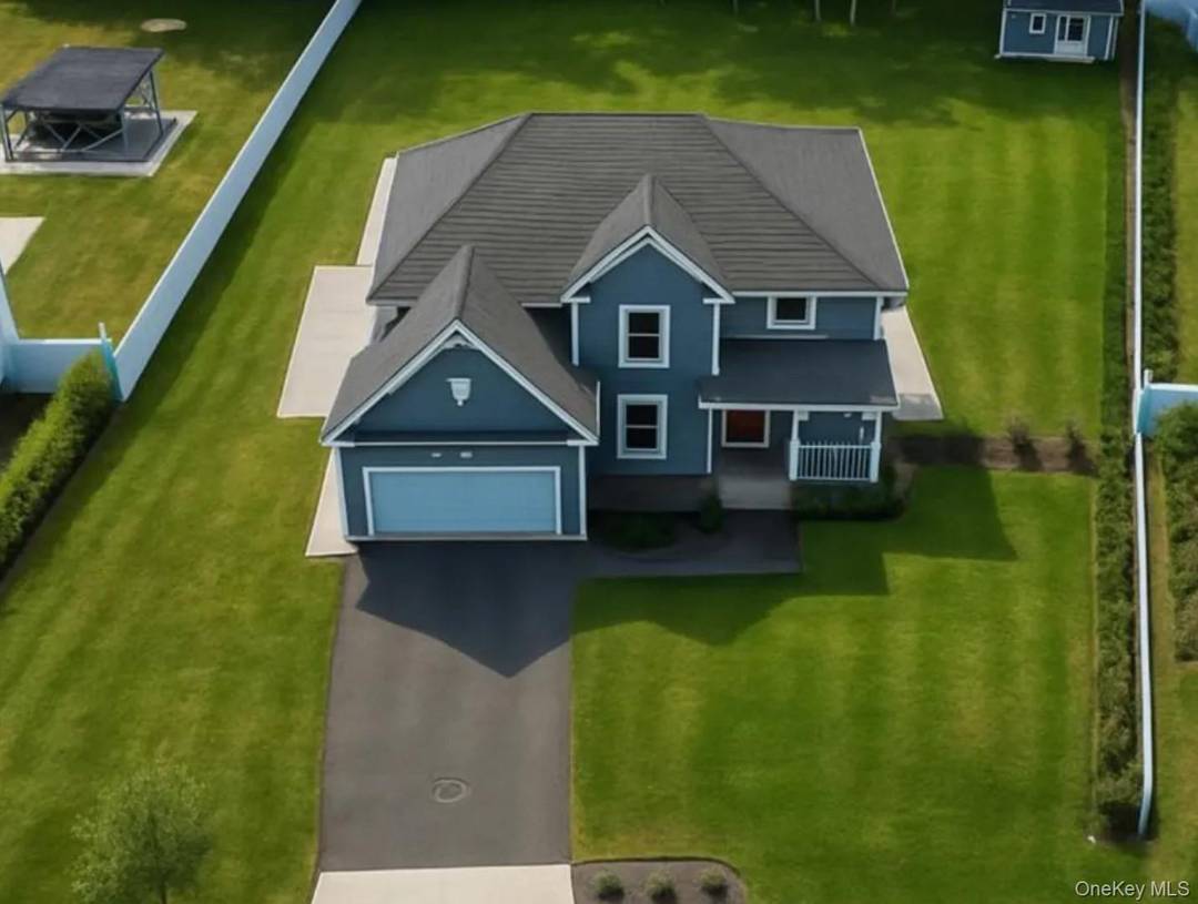 Welcome to 9 Shaw Lane, a brand new 2023 custom built home on a private cul de sac in East Moriches.