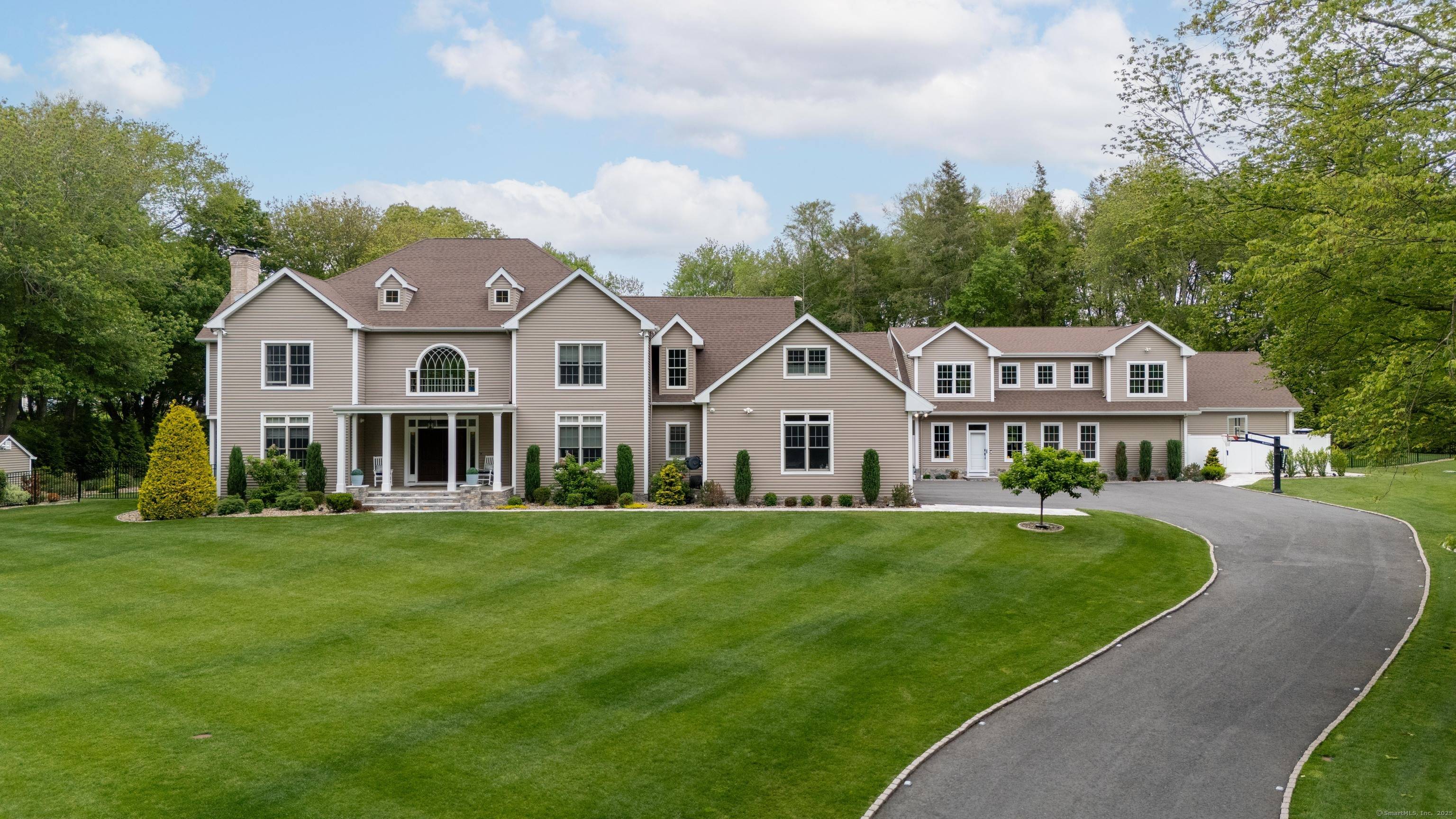 As featured in JamesEdition Every moment feels like a retreat for guests of all ages at this completely remodeled and expanded Colonial at 15A Shore Rd.