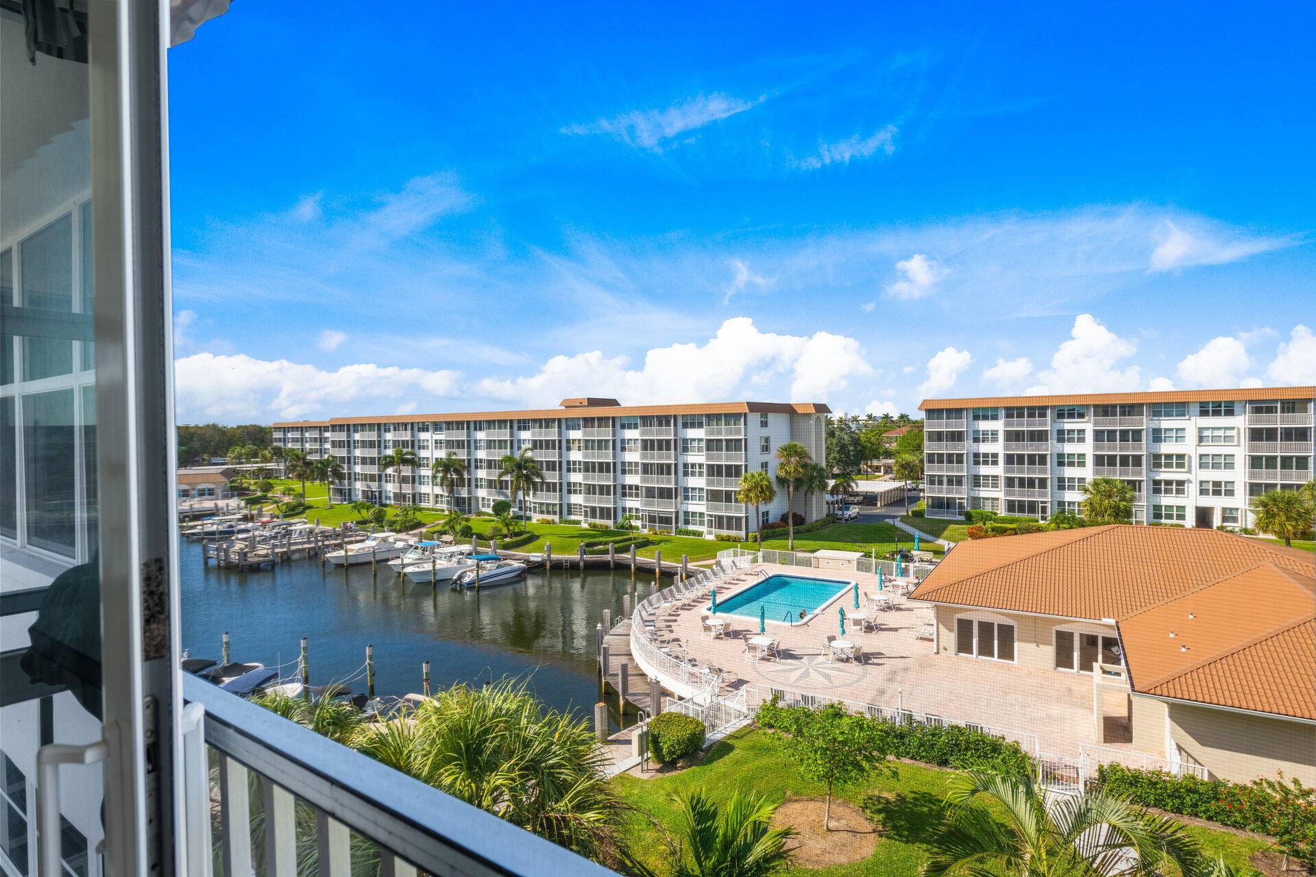 This 2 bedroom 2 bathroom stunning penthouse 55 condo offers serene waterfront views of the marina and pool, providing a daily escape to paradise.