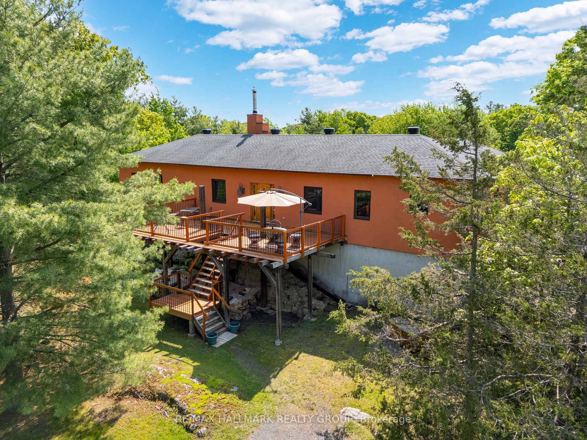 Set back from the road and perched proudly on a natural rock formation, this truly unique home is bursting with personality and charm.