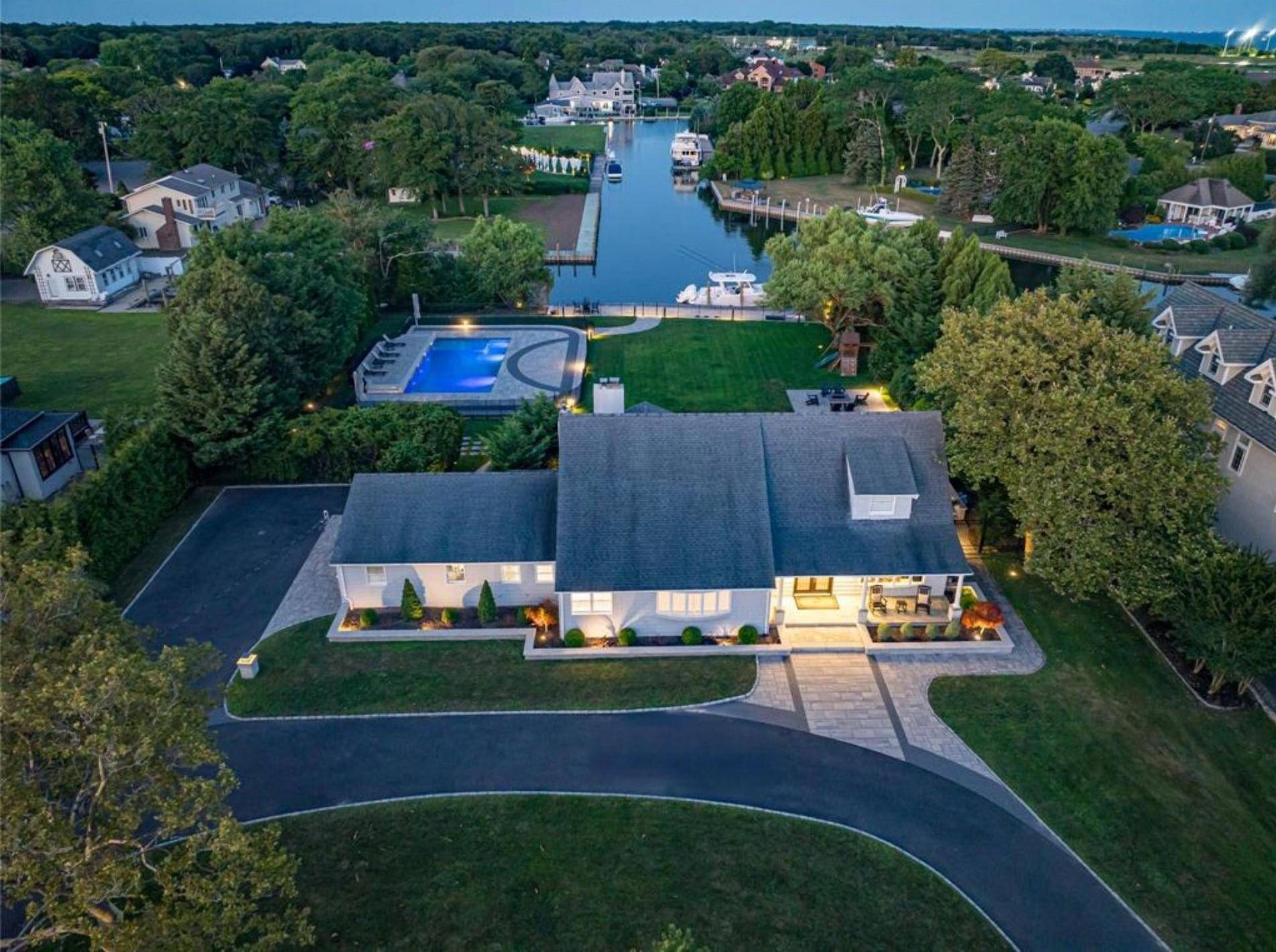 Located in the exclusive, gated community of The Moorings, this exceptional Farm Ranch offers 3, 105 square feet of thoughtfully designed, open concept living space on an expansive 0.
