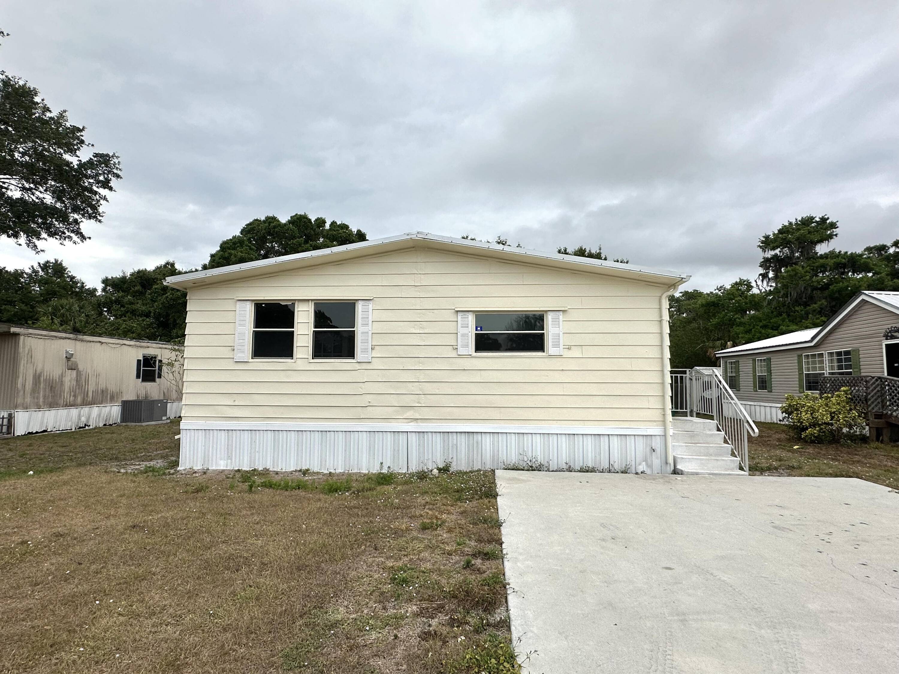 TREASURE ISLAND 2 bedroom, 2 bathroom double wide mobile home with additional office space that can also be used as a bedroom if desired.