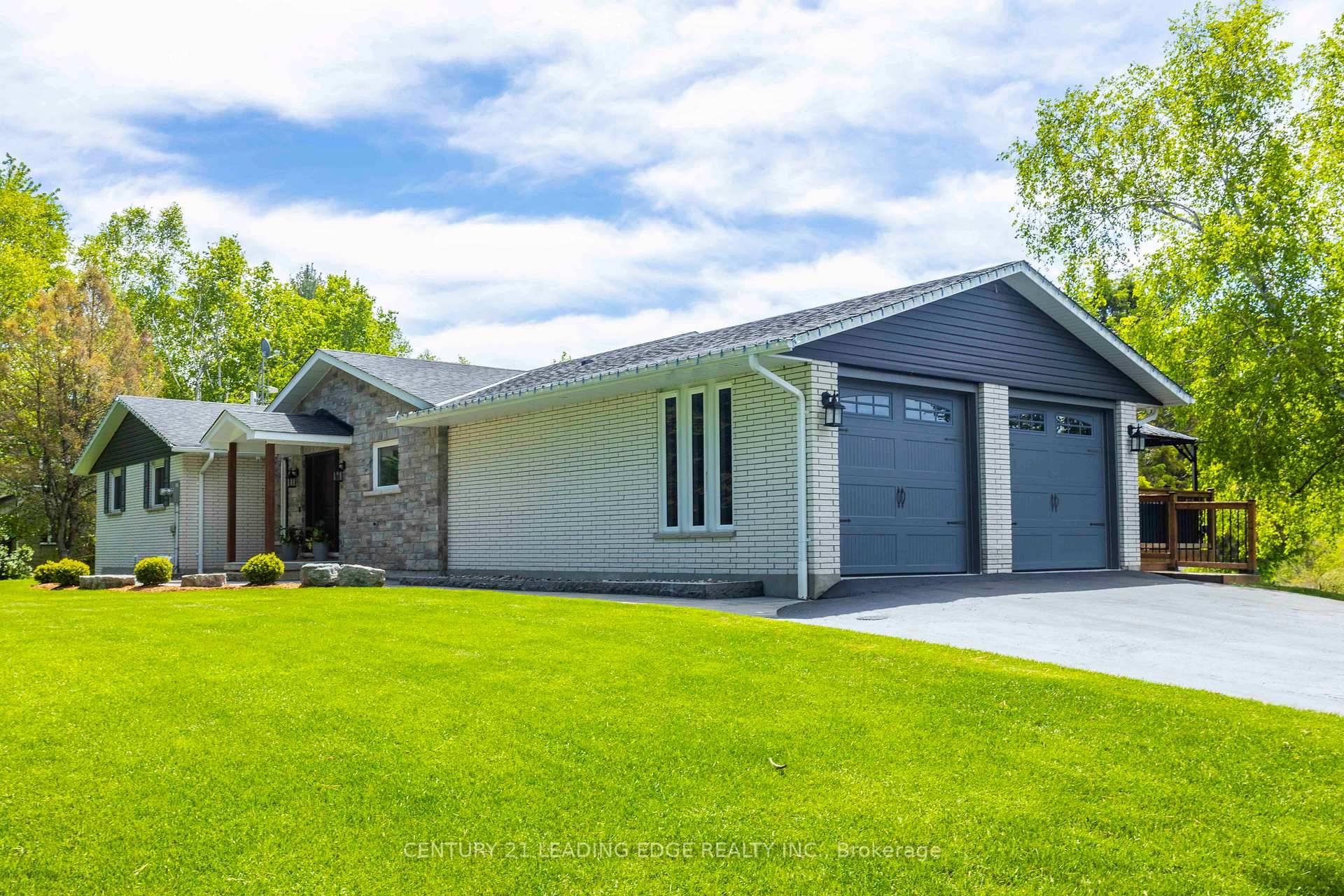 Experience the charm of this fully customized raised bungalow country estate, thoughtfully designed for luxurious and comfortable living.