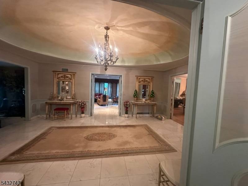 Nestled in the coveted Deerfield section of Short Hills, this rare opportunity invites a discerning buyer to restore an elegant brick manor to its original beauty and grandeur.