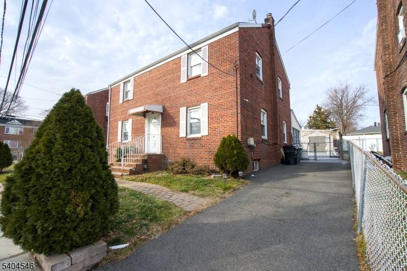 Well maintained brick two family property featuring side by side units, offering added privacy and minimal noise transfer compared to traditional up and down multifamily layouts.