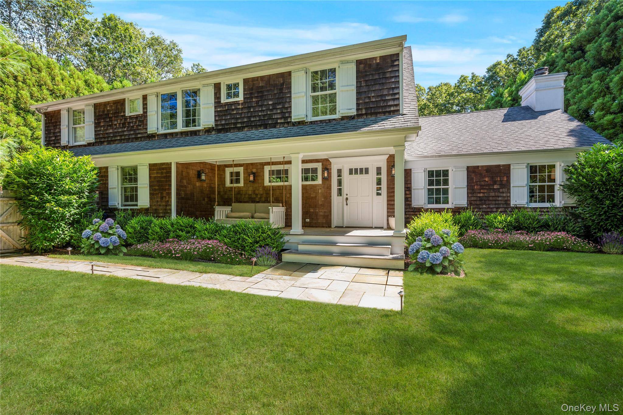 NORTHWEST WOODS OASIS Welcome to this designer appointed, mint condition traditional home, ideally located in the heart of East Hampton's coveted Northwest Woods.
