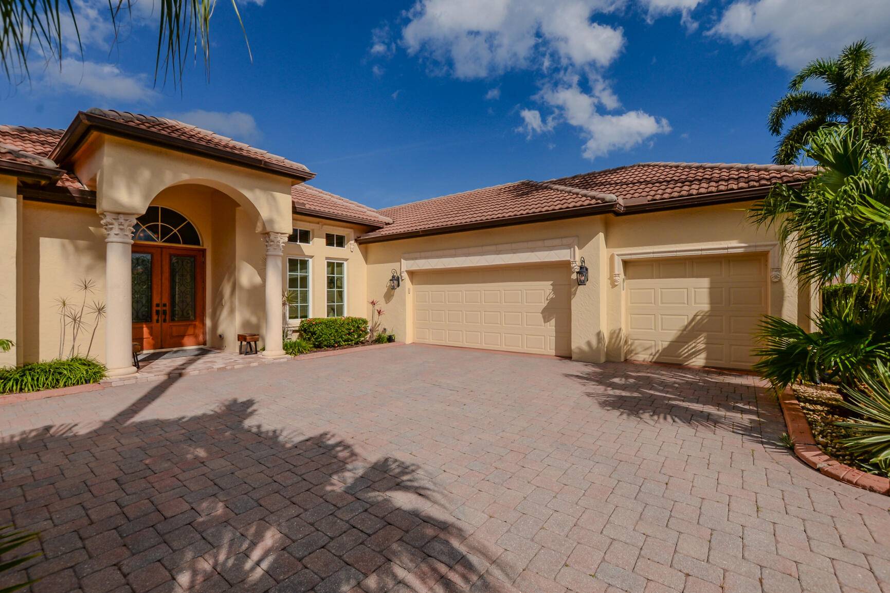 Stunning Mediterranean inspired 4 bedroom 3 bath lakefront home shows pride of ownership in every detail.