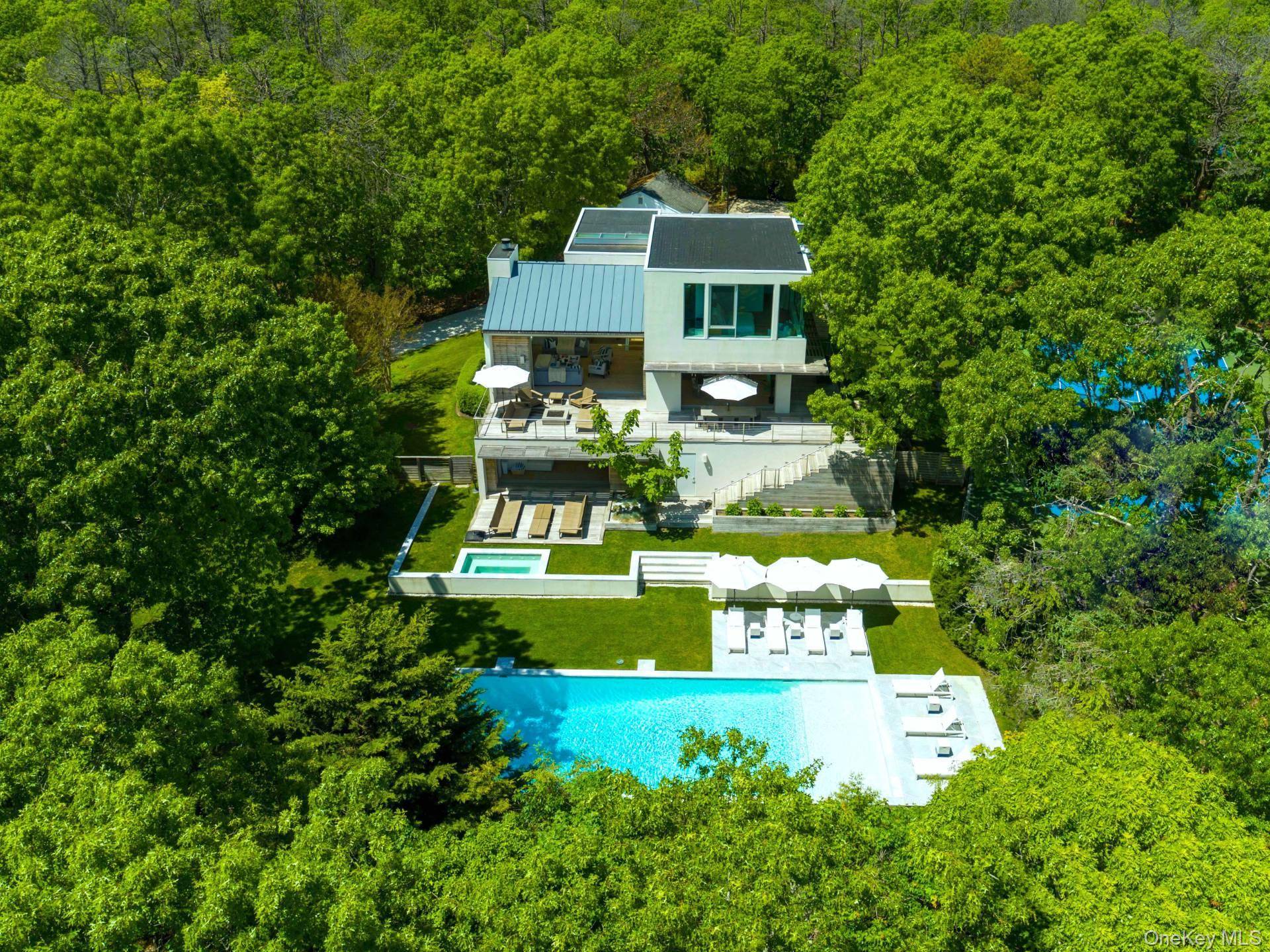 In a class by itself, New to Market, exquisite Malibu Style Modern Contemporary perfectly suited on a meticulously well kept shy 2 acre parcel with Pool and Tennis offering the ...