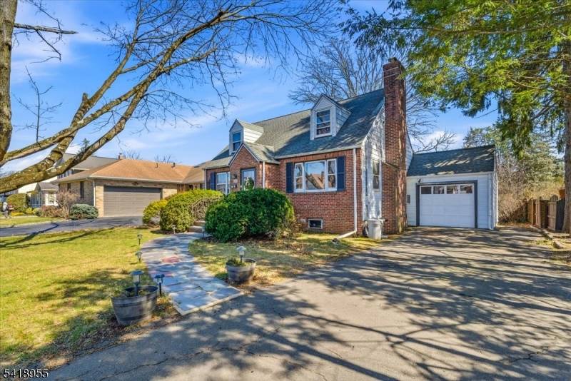Charming Cape Cod home that offers more than meets the eye, thoughtfully maintained and expanded for today's lifestyle.
