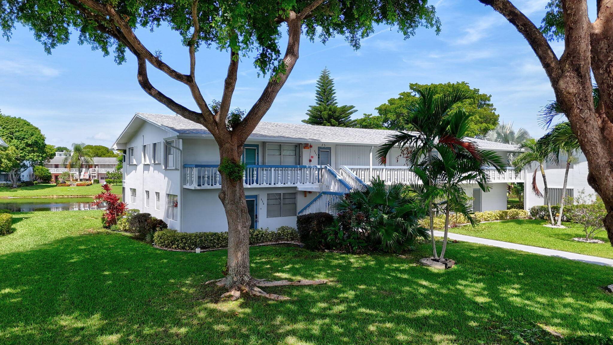 Welcome to this bright and spacious 2 bedroom, 2 bathroom garden level corner condo featuring serene water views of the lake.
