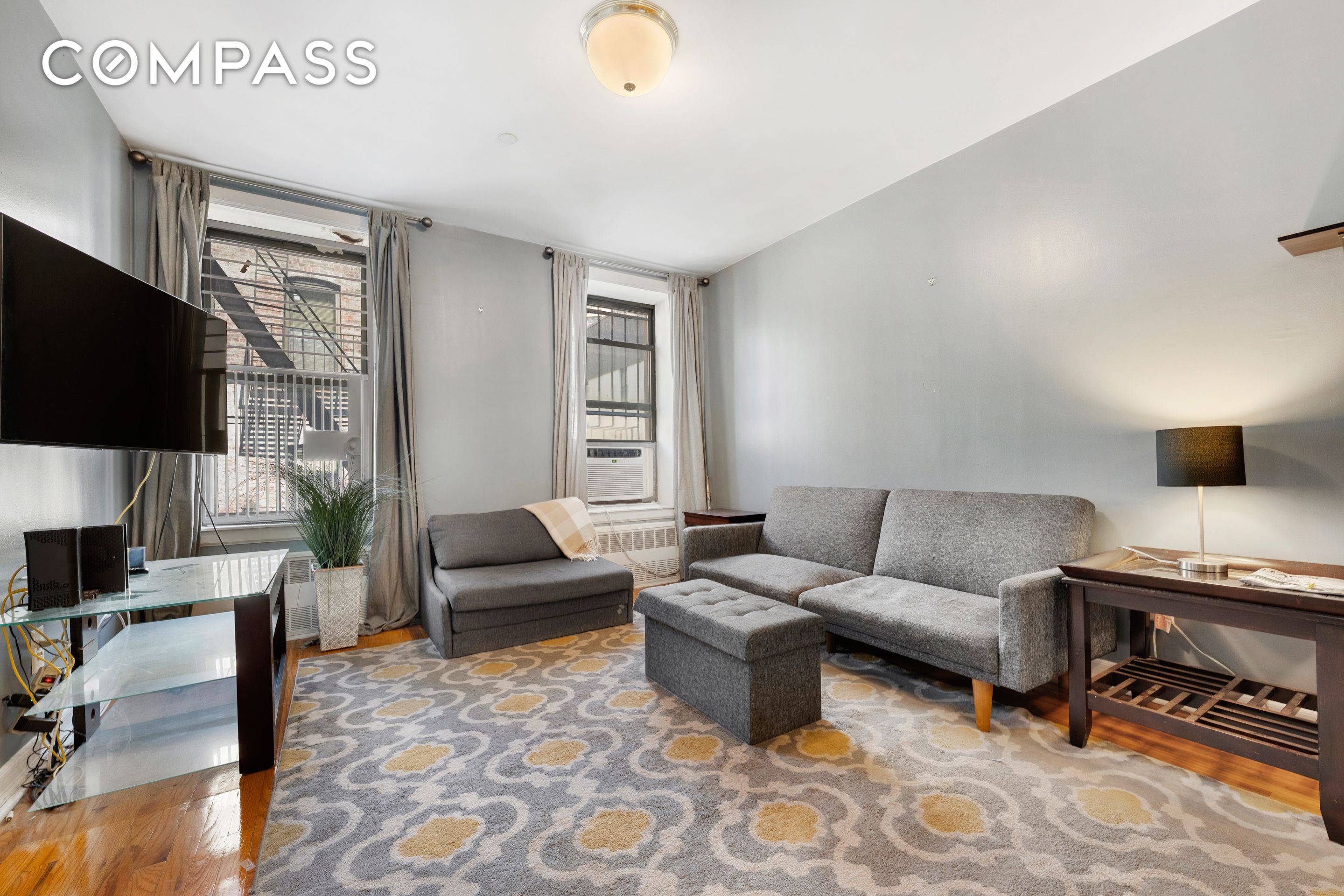 Just a half a block from Central Park, this lovely HDFC 2 bedroom 1 bathroom home has gleaming hardwood floors, high ceilings, a pass through windowed kitchen with an in ...
