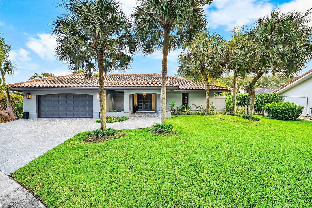 Situated on a rare oversized cul de sac lot in Boca Raton's coveted Millpond, this 4BR 2.