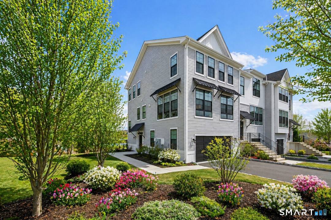 Located in the sought after Woodlands at Rivington community, this end unit townhouse offers a bright, open concept layout designed for both everyday living and entertaining.