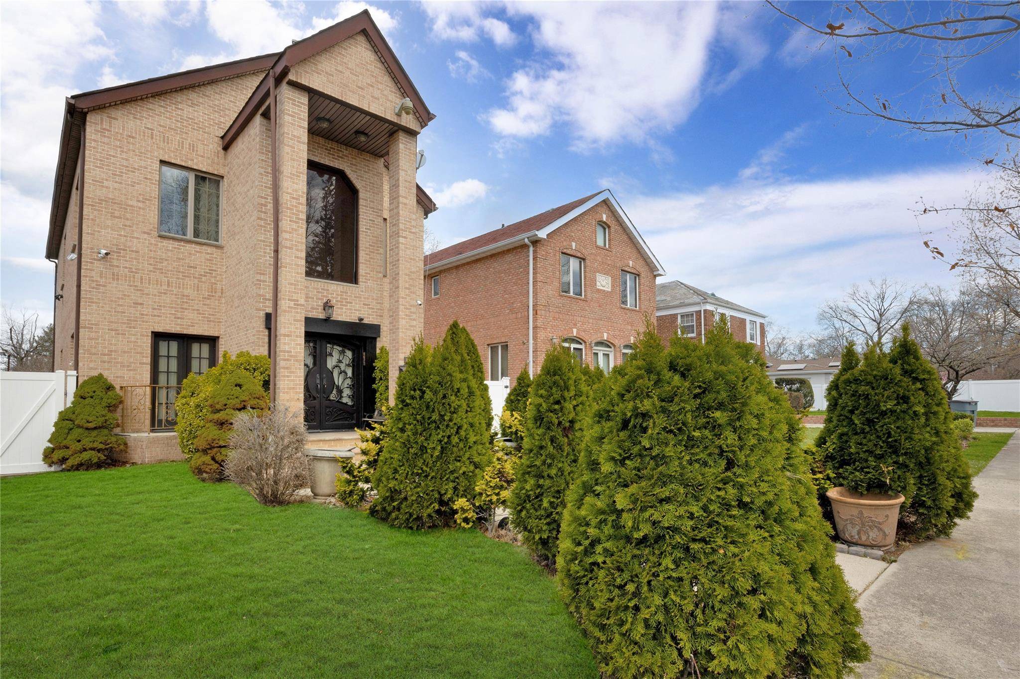 Welcome to this stunning four bedroom, 3 1 2 bath colonial home, situated on an expansive 40 x 154 property in the prestigious neighborhood of Jamaica Estates.