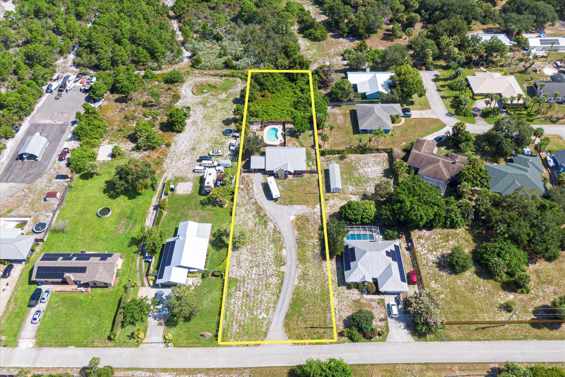 Bring your toys ! This charming 2 story custom built pool home is nesteled on over an acres 1.