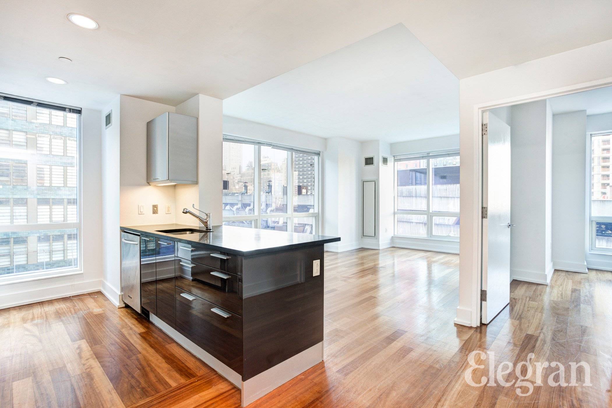 Sun blasted corner 1 bedroom unit in the Orion Condominium on West 42nd street.