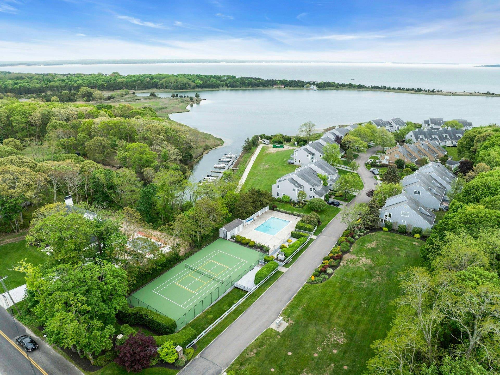 Lovely light filled 3 bedroom 3 bath inland end unit in The Cove a small hidden gem of a waterfront community nestled in the heart of the North Fork.