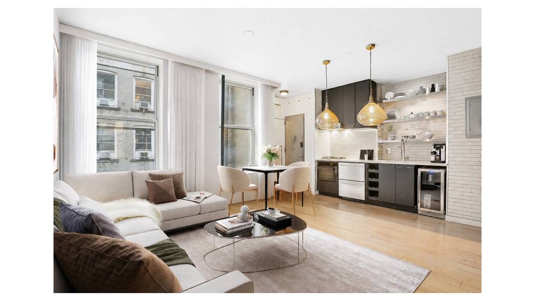 Tucked along a peaceful, tree lined block in the heart of SoHo, this beautifully curated junior one bedroom home blends modern design with classic downtown charm.