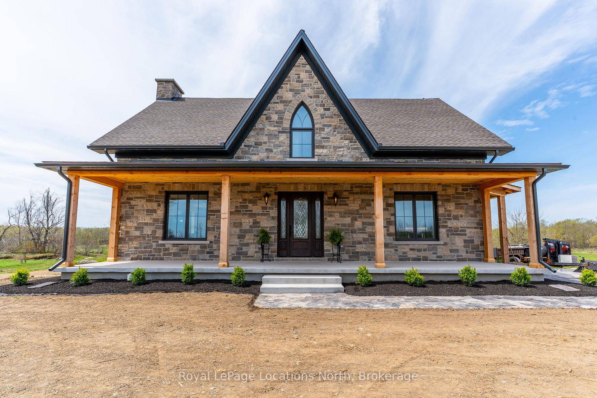 Welcome to this breathtaking, brand new stone Gothic Farmhouse, where old world charm meets modern luxury on a picturesque 65 acre estate.