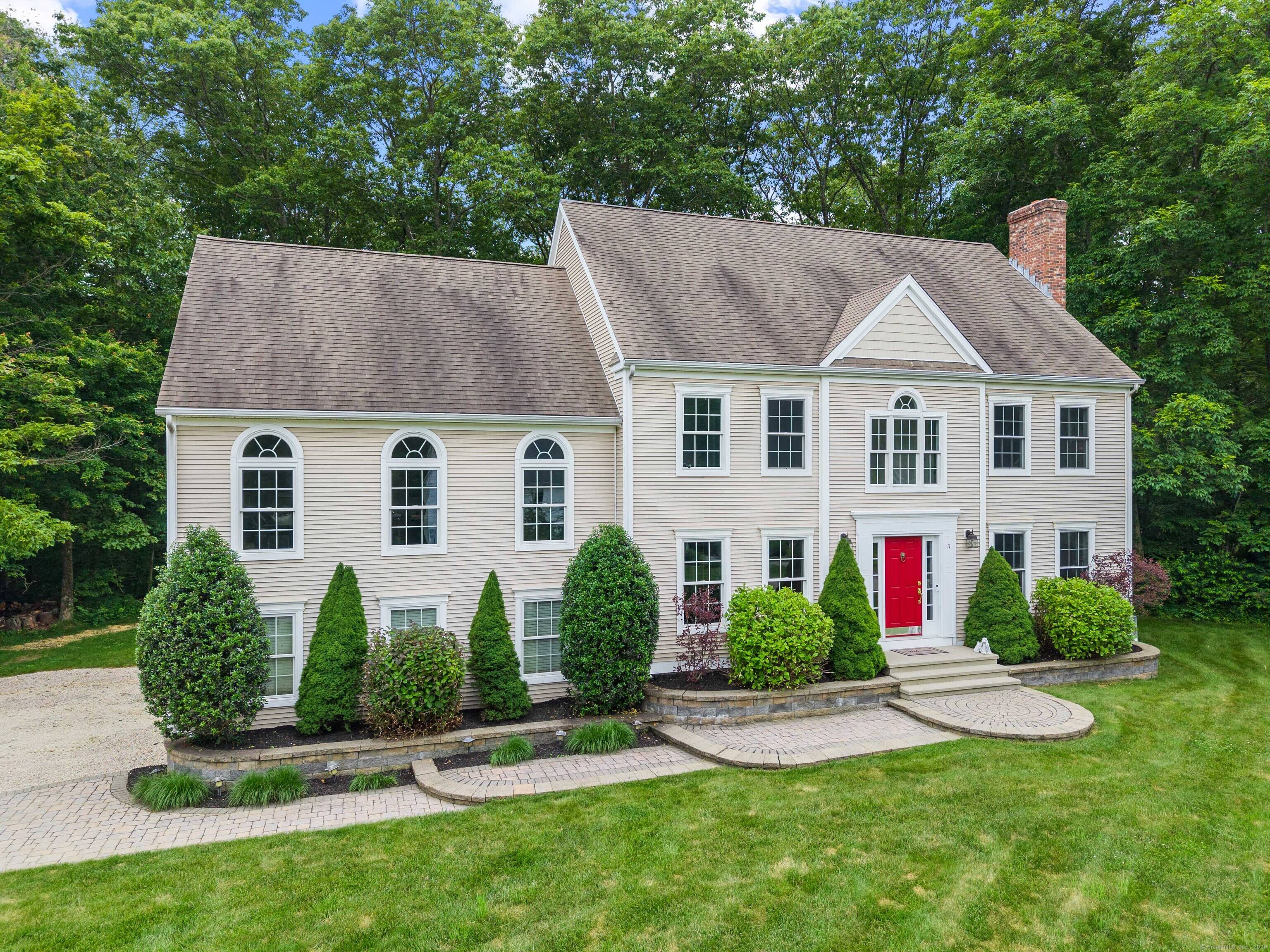 Welcome to this stately Colonial nestled on over an acre in a peaceful cul de sac neighborhood.