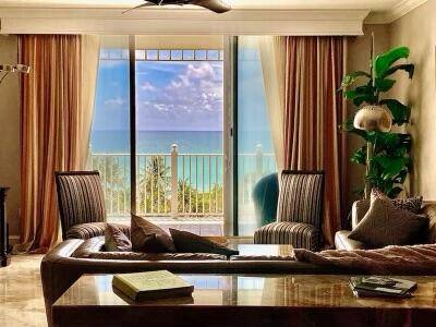 Experience sweeping ocean views and serene tropical surroundings from this beautifully furnished 2 bedroom, plus den, 2.