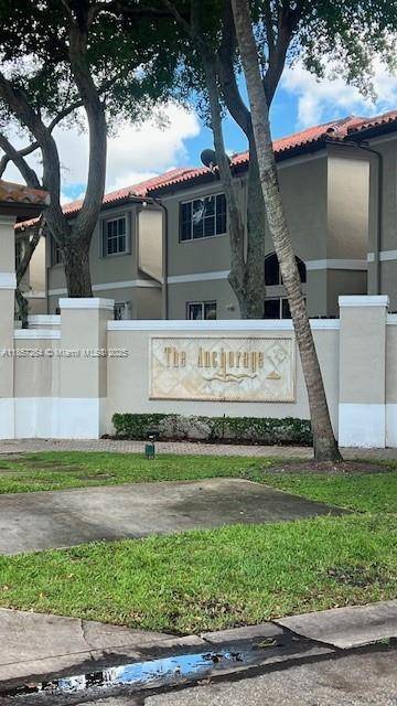 Centrally located in the heart of Miami Lakes, this spacious townhouse offers convenience and potential.