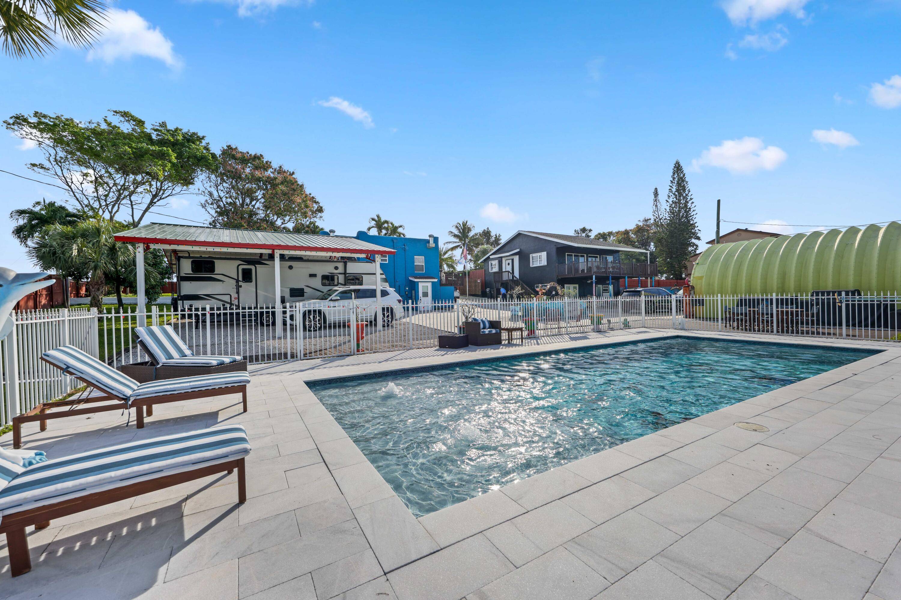 Experience historic elegance in this 1930 Spanish Style home, perfectly situated minutes from I 95, downtown Lake Worth Beach, and pristine beaches.