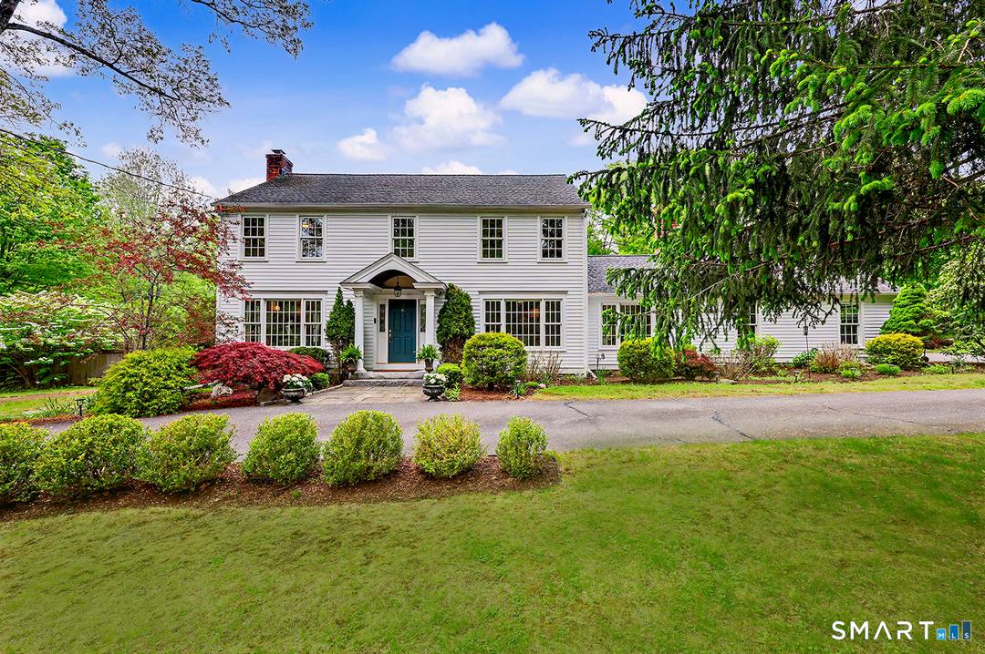 Curb appeal abounds in this picture perfect Colonial, newly clad in white cedar and set in a coveted neighborhood of upscale homes and walkable, picturesque streets.