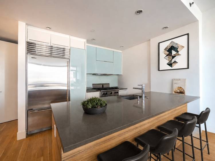 This beautifully proportioned two bedroom, two bath residence captures abundant southern light through floor to ceiling windows and glass doors that open to private balconies off both the living room ...