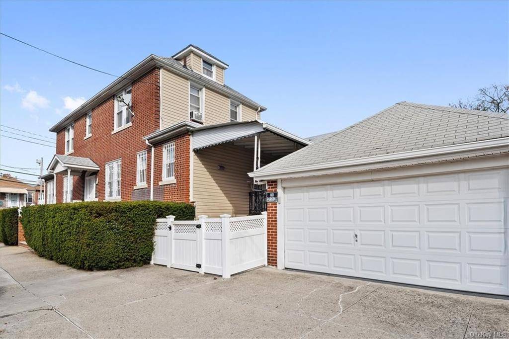 Morris Park Brick Detached Single family with 2 car garage and separate tax lot.