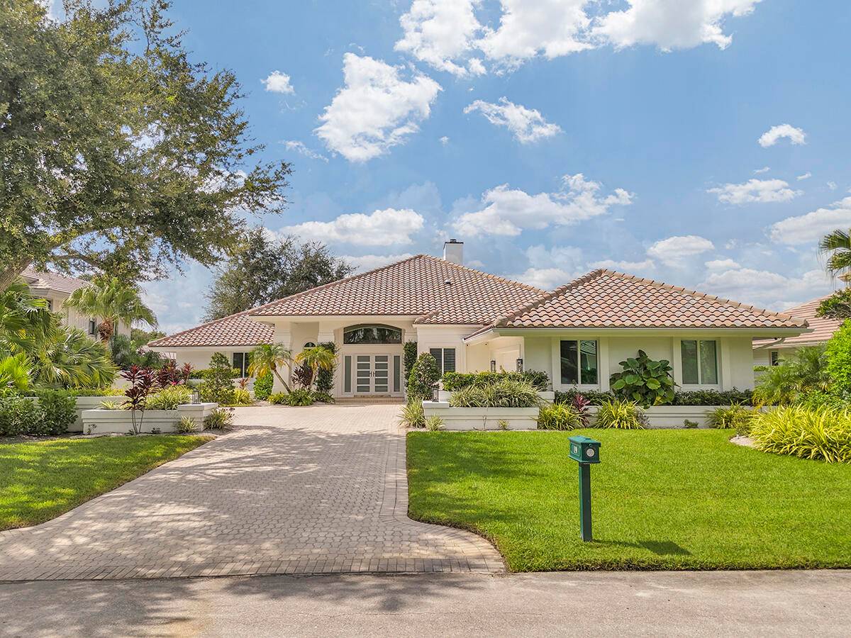 Experience luxury living on the 8th hole of the Match Course in prestigious PGA National.