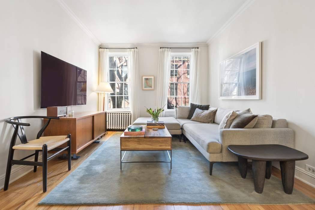 Situated on a tree lined stretch of Perry Street between West 4th and Bleecker Streets, Apartment 2R is the quintessential West Village home.