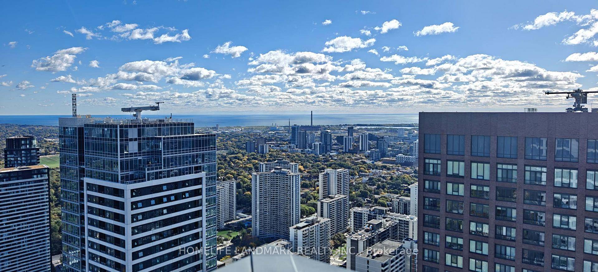 Facing South, high celling with unobstructed panoramic view of the CN Tower, lake and the city.