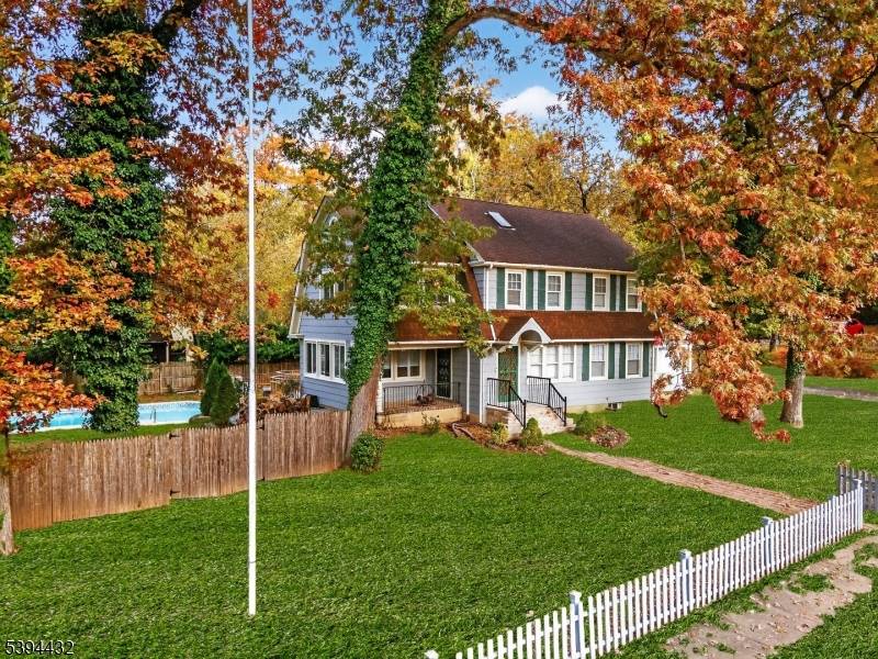 This lovely Colonial style home is located on a corner lot in the desirable Sleepy Hollow area.