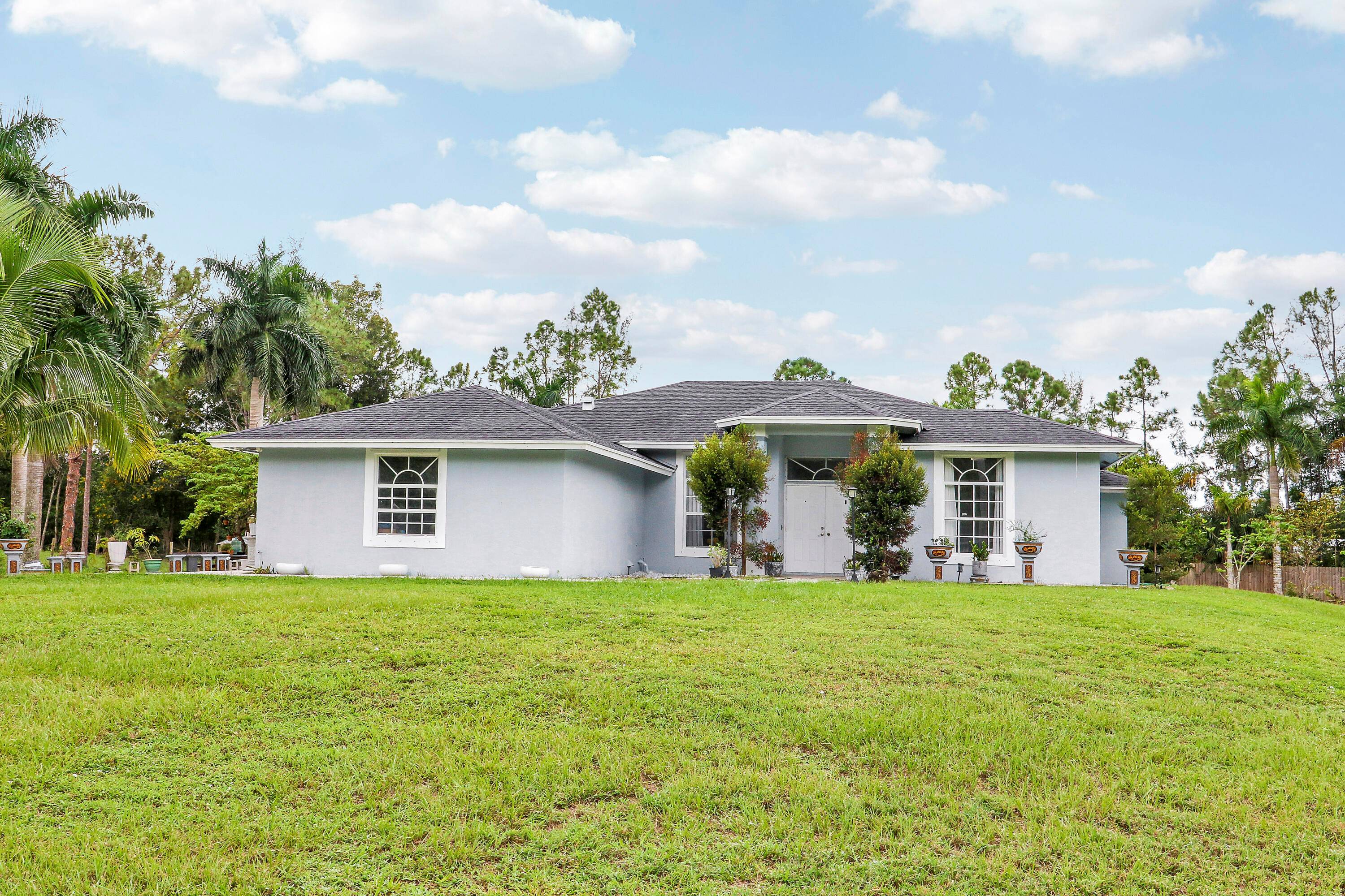 Welcome to this spacious 4 bedroom 2 bathroom home with a 2 car garage, set on a private 1.