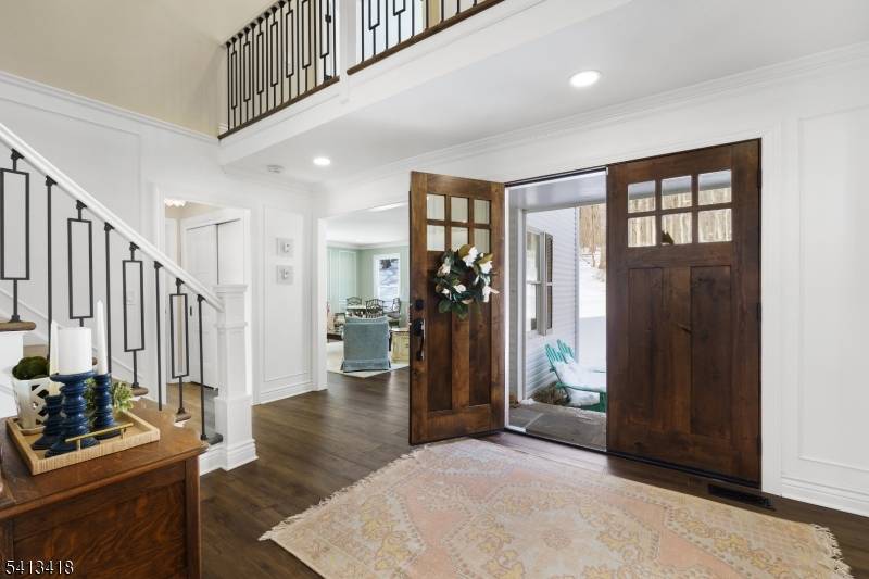 Welcome to this beautifully reimagined 4, 437 square foot Colonial, privately nestled on 4.