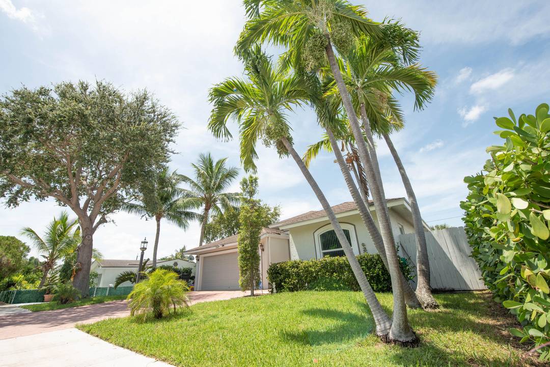 Gorgeous and private coastal home tucked away in one of South Florida's most desirable neighborhoods Lake Worth Beach's Palmway corridor.