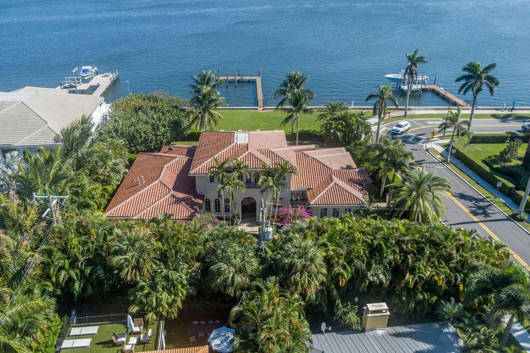 Enjoy beautiful views of the coveted Mar a lago Estate from this direct Intracoastal waterfront estate offering over 6000 total square feet of luxury living.