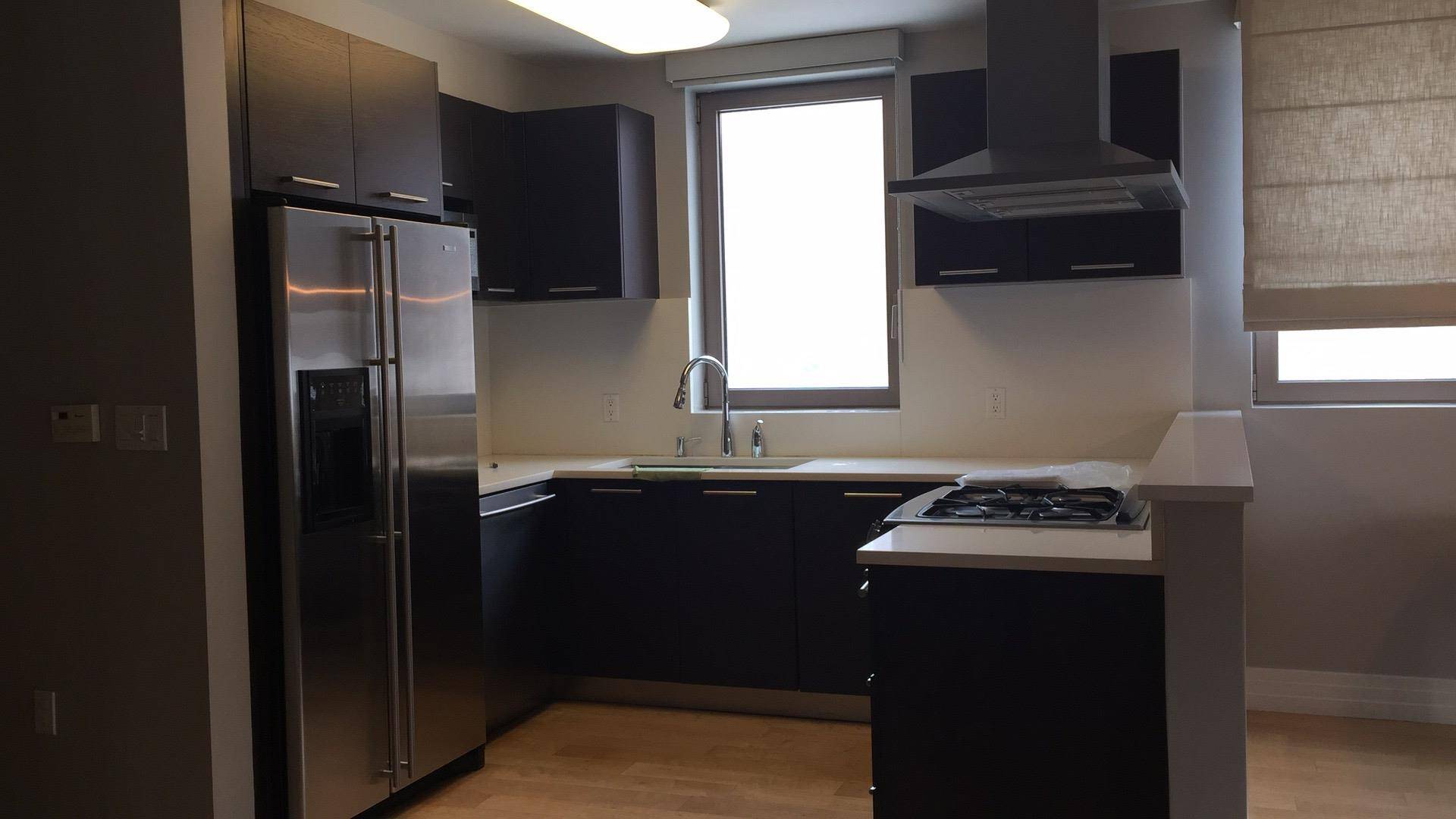 VIRTUAL TOURS AVAILABLE TOWNHOUSE STYLE CONDO DEEDED PARKING SPACE Located in Forest Hills, this expansive 2 bedroom, 2.