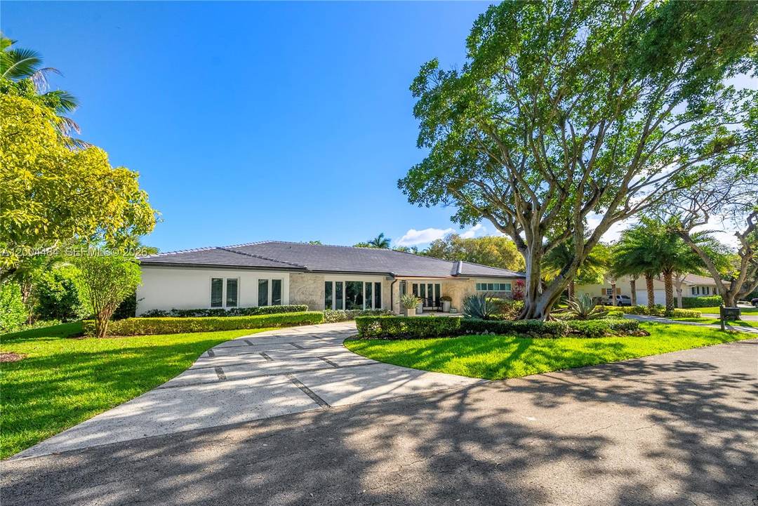 Tucked away on a quiet South Gables cul de sac, this meticulously renovated 5 bedroom, 4.