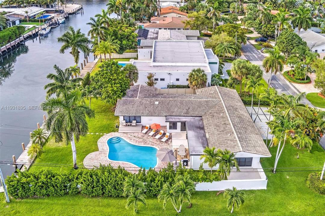 Corner waterfront estate situated on an expansive lot within the prestigious gated Golden Isles community.