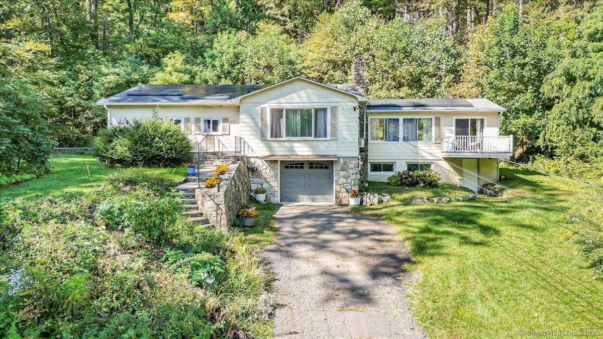 This beautifully maintained New Fairfield home offers comfort, light, and privacy on more than 2 acres of land.