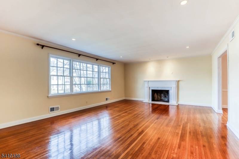 Absolutely stunning 6 bedroom, 3 full bath custom home located in the highly desirable Poet Section of Short Hills.