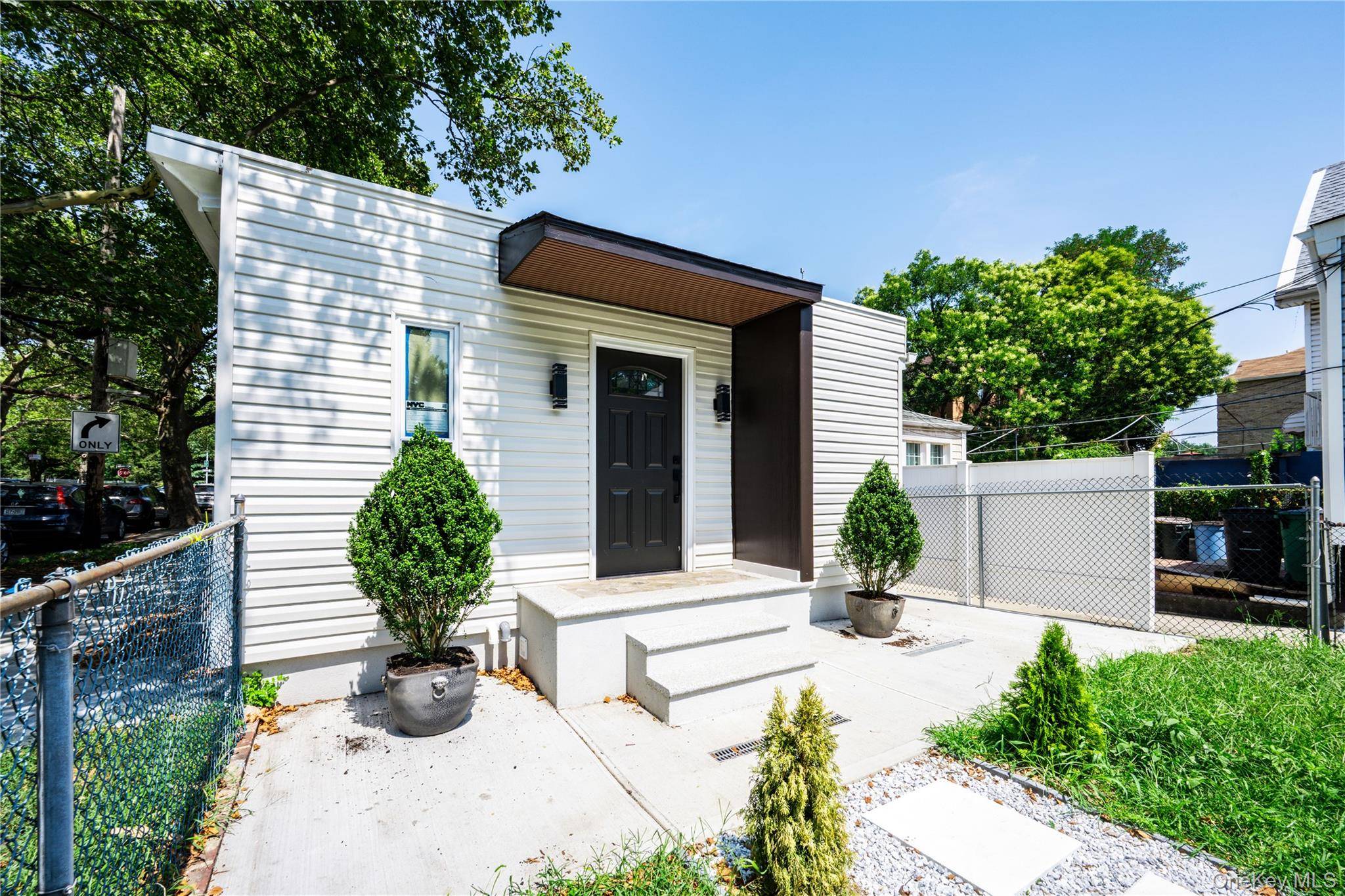 This charming, beautifully renovated single family home is situated on a lovely corner lot measuring 25 x 100.