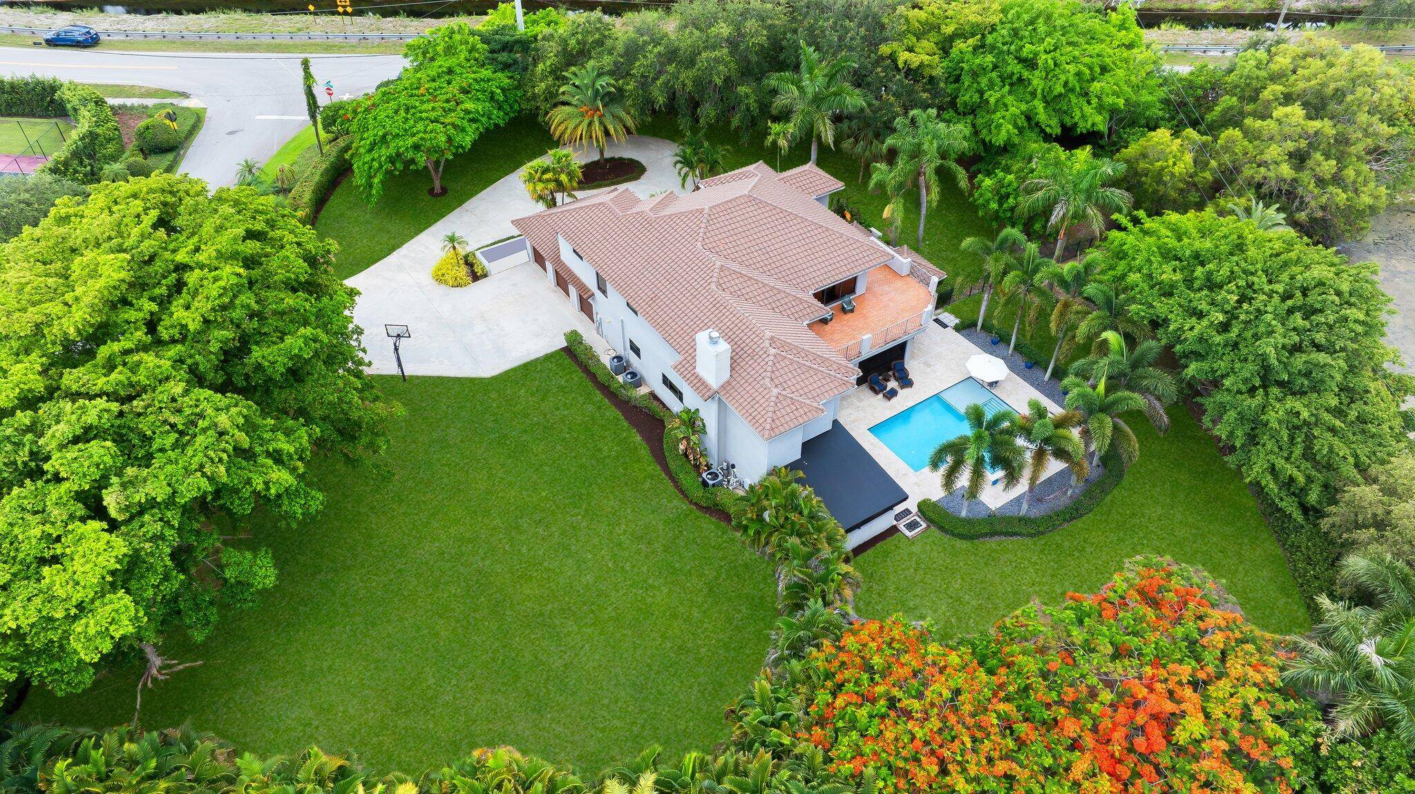 Welcome to 17953 Boniello Road, a remarkable estate situated on over an acre in the highly sought after community of Boniello Acres in Boca Raton.