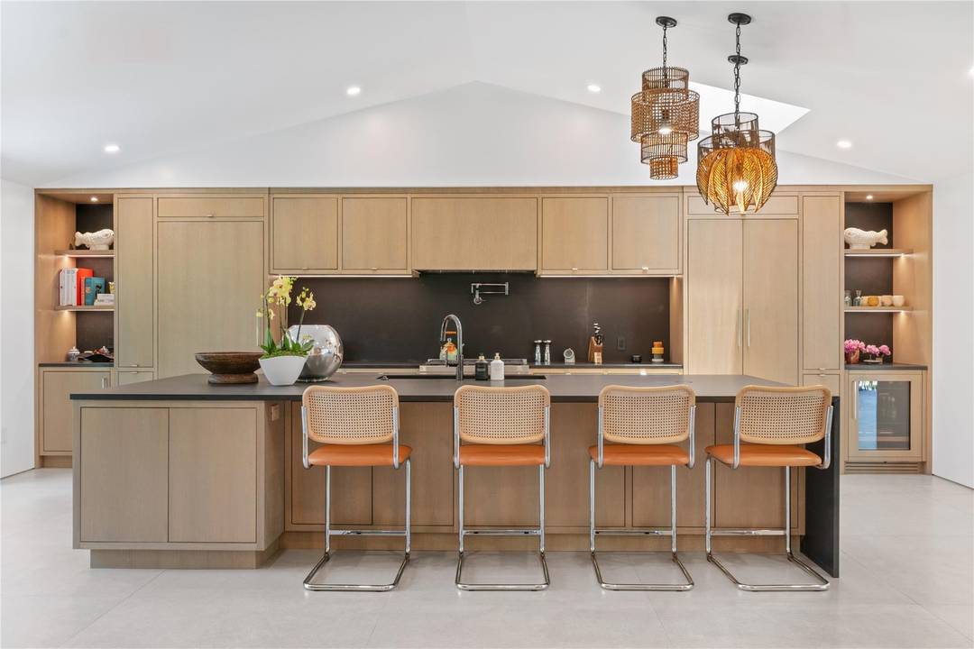 Custom renovation completed in 2023, this architecturally refined residence features a new roof, plumbing, electrical, windows, and septic system offering modern infrastructure paired with exceptional design.