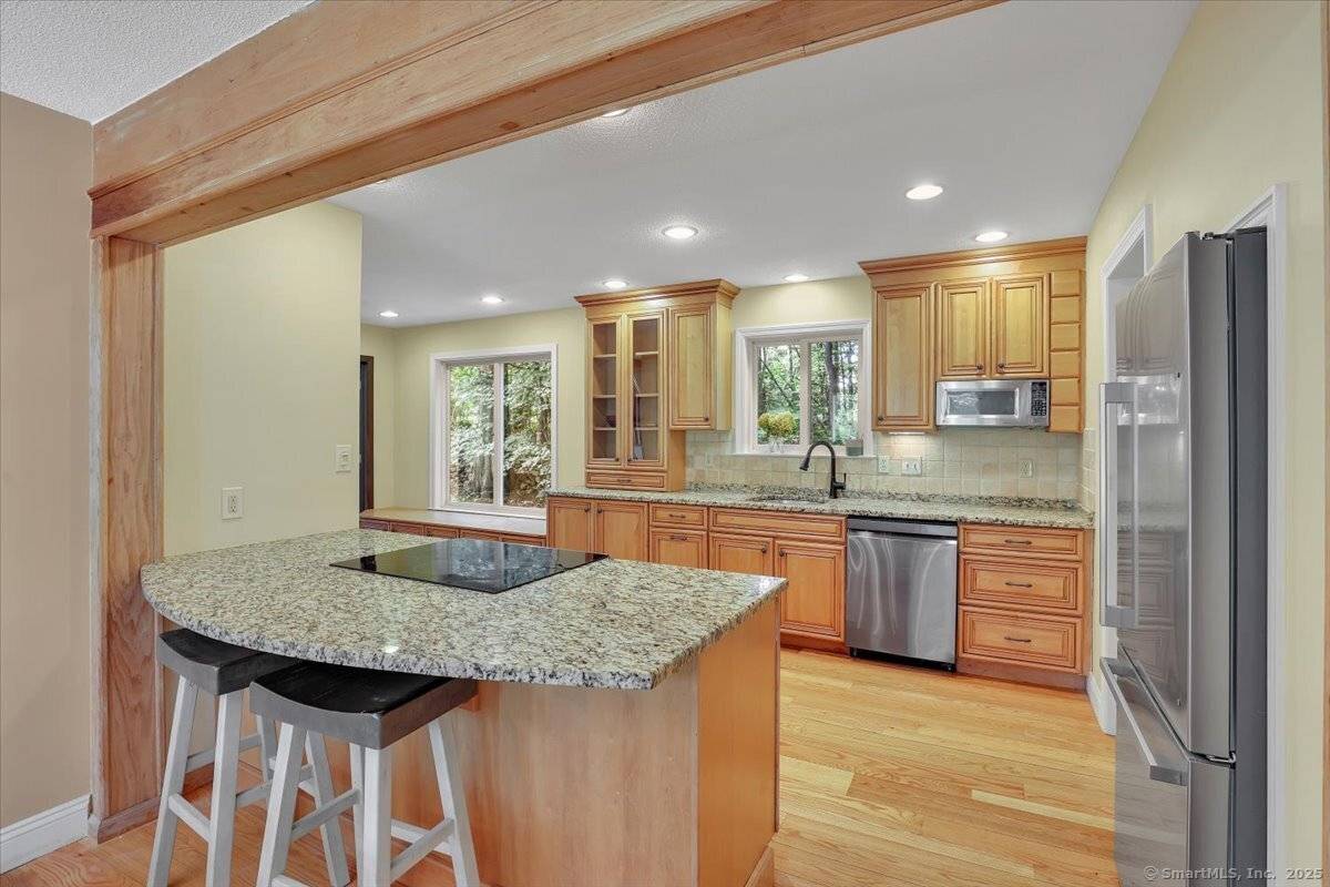 Welcome home to this beautifully updated 4 bedroom Colonial, privately set at the end of a shared driveway and abutting town owned land for added privacy.