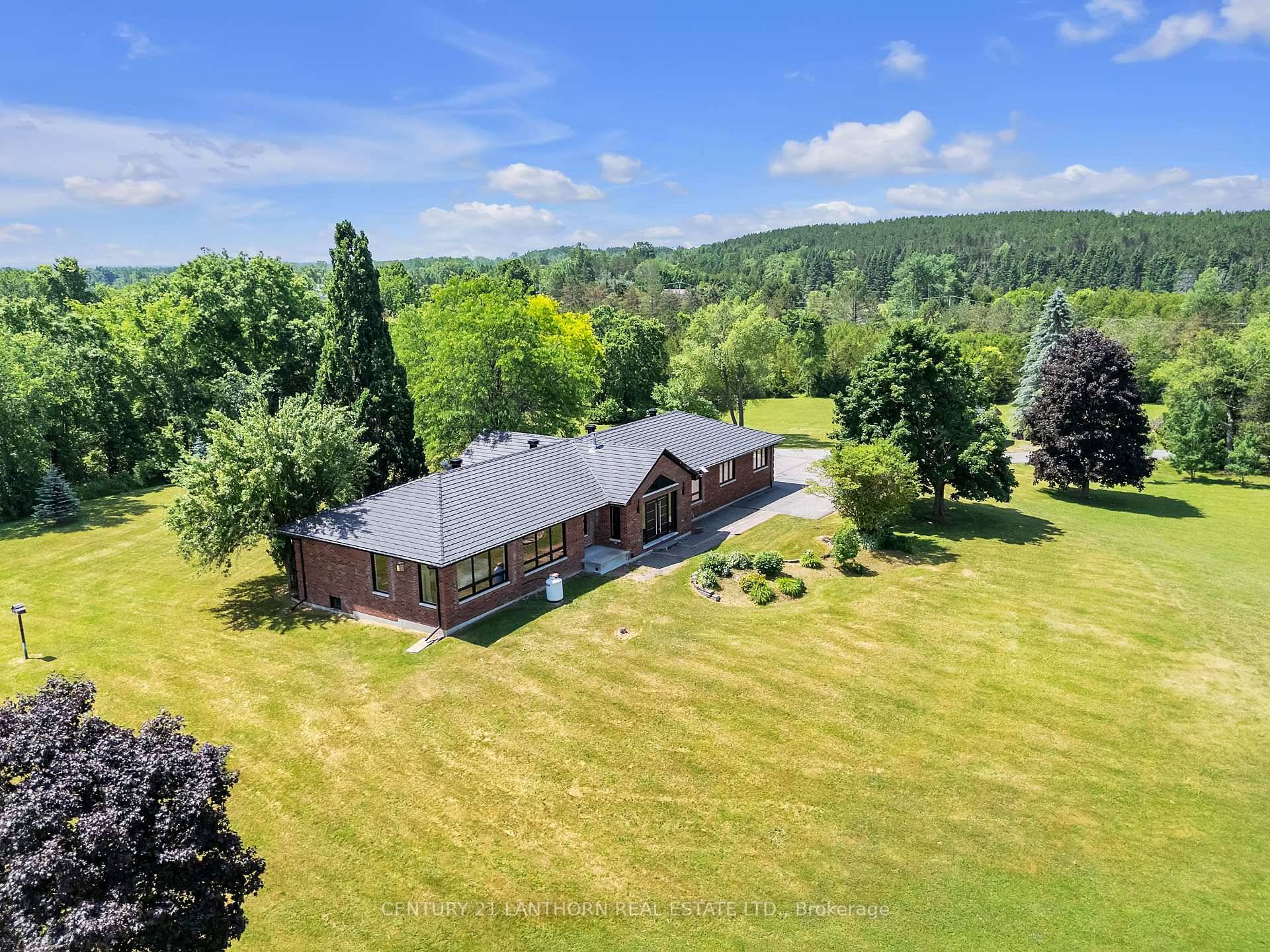 A gently curving paved driveway leads you to 676 Foxton Road, where this meticulously renovated all brick bungalow is situated on approximately 32 acres of idyllic landscape.